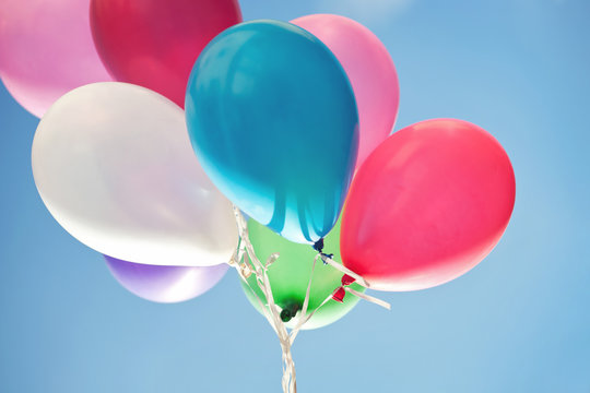 Colorful balloons against blue sky