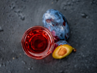 Some Plum Liqueur on a dark slate slab