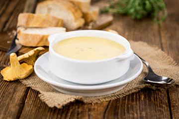 Fresh made Creamy Chanterelle Soup on a rustic background
