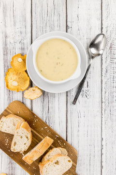 Fresh made Creamy Chanterelle Soup on a rustic background