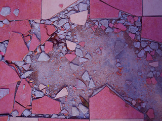 Pale red white cracked broken ceramic grungy grainy texture cement tile floor, with red short cut hair residue, mysterious