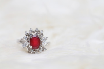 Obraz na płótnie Canvas red gemstone on diamond ring