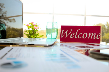  business work place with welcome sign on the table in the office