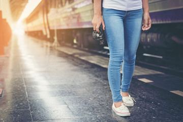 Girl traveling the tourist train station, Active and travel lifestyle concept