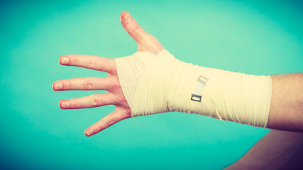 Male hand in bandage.