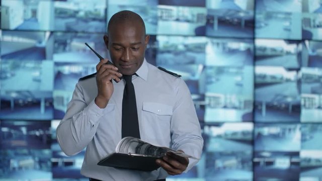  Portrait smiling security officer in system control room