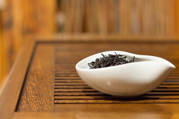 Chahe with black tea for Chinese tea drinking on the table. Traditional Chinese tea drinking ceremony.