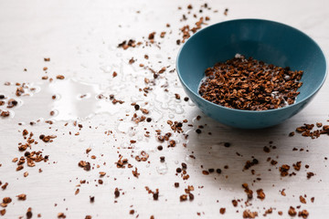 Healthy cereal breakfast. Sweet granola on untidy background. Wholegrain vegetarian morning tasty food.