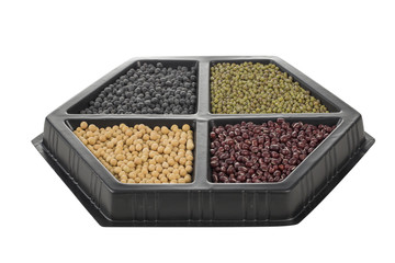 Different colorful beans in container, soybeans, black beans, mung beans and red beans.