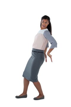 Businesswoman Pushing Behind Against White Background