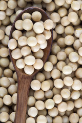 Soy beans and wooden spoon.
