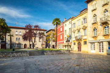 Town square with colorful facade of an old houses in Porec, Croatia, Europe.