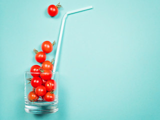 Tomato juice or smoothie, cherry tomato in drink glass with straw