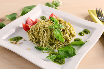 Delicious pasta with pesto sauce on plate