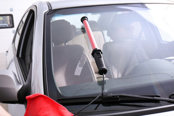 Fixing crack on car windshield in repair shop