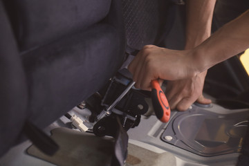 Auto mechanic fixing car in repair shop