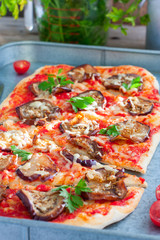 Vegetable pizza with eggplant, selective focus