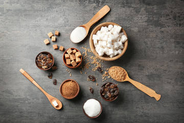 Various kinds of sugar on grey table