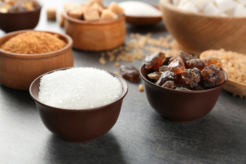 Various kinds of sugar on grey table