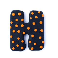3d black and orange dotted text word letter H isolated on white background. Cute halloween cartoon figures handmade handicraft for clay plastiline	