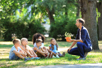 Group of children with teacher in park