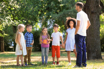 Group of children with teacher in park