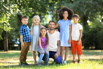 Group of children with teacher in park