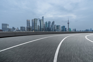 urban traffic road with cityscape in background in Shanghai,China..