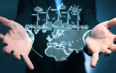 Businessman holding renewable energy sketch