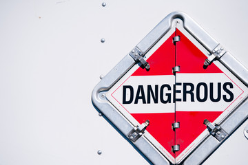 The sign dangerous in the safety box on the semi trailer wall