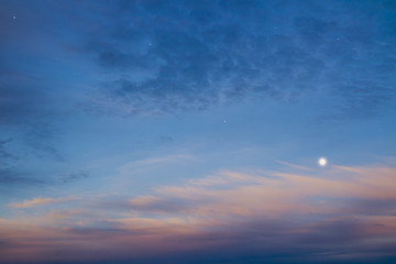 Beautiful night sky with moon and stars, majestic sunset. Sky and clouds at beautiful evening.