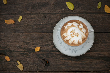 Hot coffee on wood background