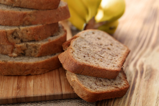 Sliced banana bread on wooden board