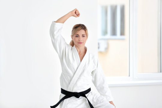 Female karate instructor training in dojo