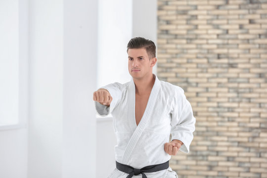 Male karate instructor training in dojo