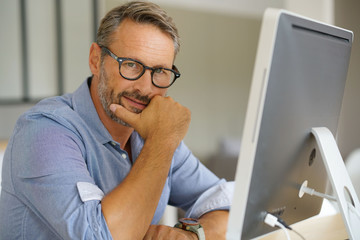 Businessman working on desktop computer