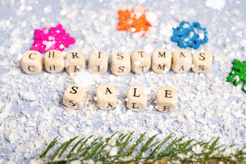 Christmas sale on the background of snow and Christmas decorations
