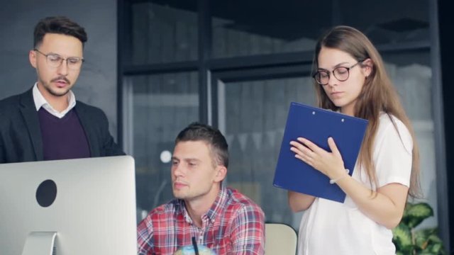 Group of young business people working together in creative office