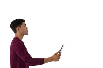 Side view of businesswoman holding digital tablet © wavebreak3