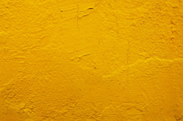 yellow concrete or cement wall with vintage style pattern for background and design art work, old grungy texture.