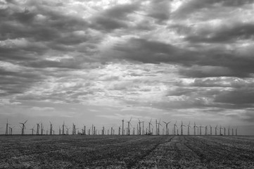 Windmills against dramatic cloudy sky