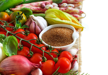 Uncooked teff grain with vegetables