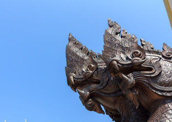 Fototapeta na wymiar Serpent made of wood in Thai temple.