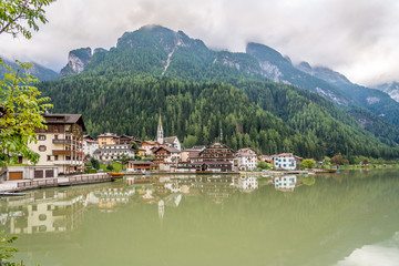 Naklejka premium Alleghe town with lake in in Italy Dolomites