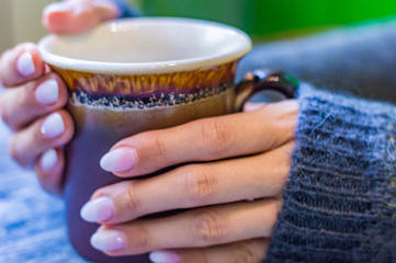 Still life with cup of tea on the wooden background