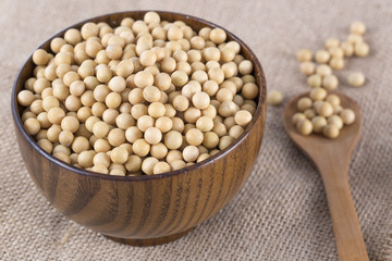Top view of soy beans in a wooden bowl.