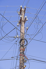 Power line electrical wire pillar with street felinar lights