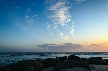 Obraz premium Clouds over the sea at sunset