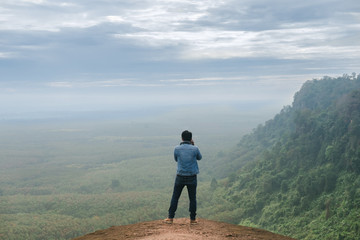 Obraz premium Photographer take a photo on Three rock wale at Phu Sing, Bungkan, nature as a classroom. Under the supervision of the Department of Forestry