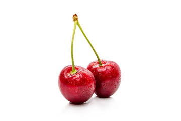 Two Cherry with water droplets isolated on white background